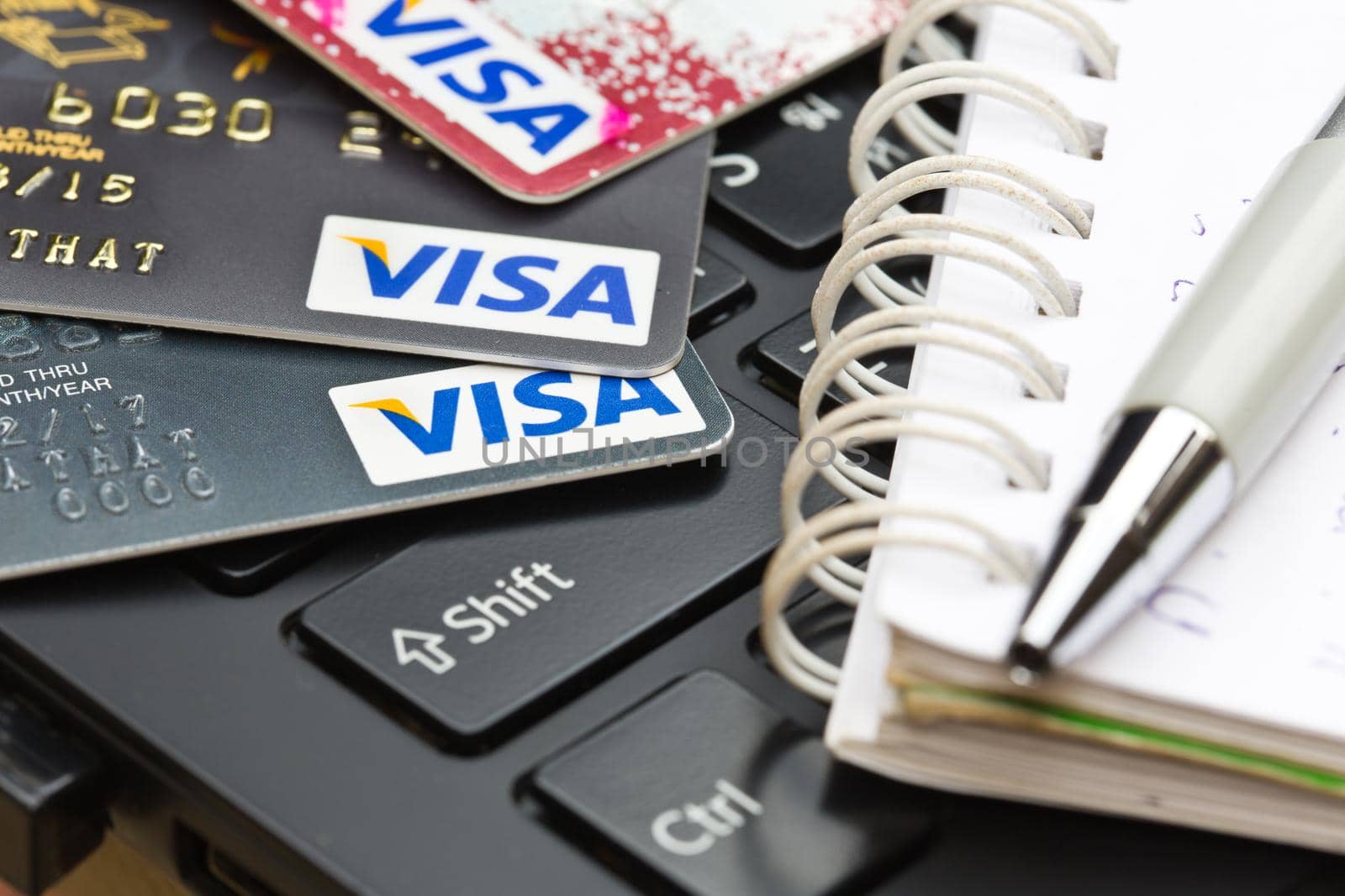 Nakhonratchasima, THAILAND - August 1, 2015 : Credit card VISA brand with pen on keyboard.