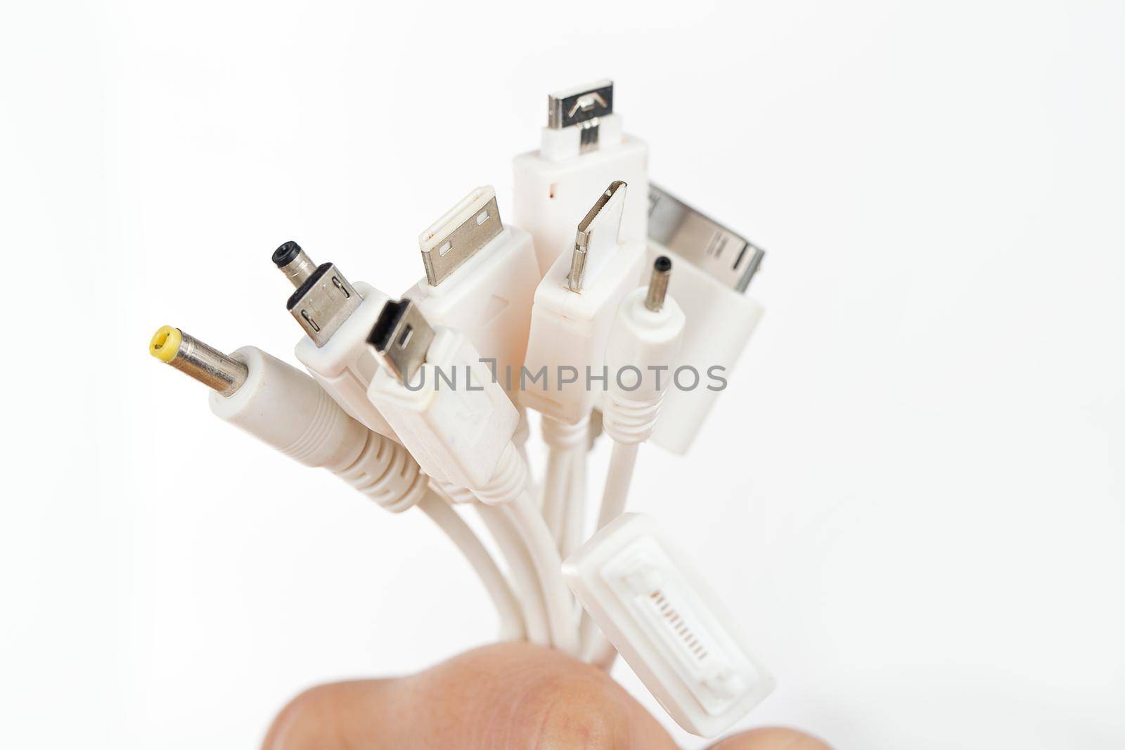 Female hand holding USB port tools charger. by jayzynism