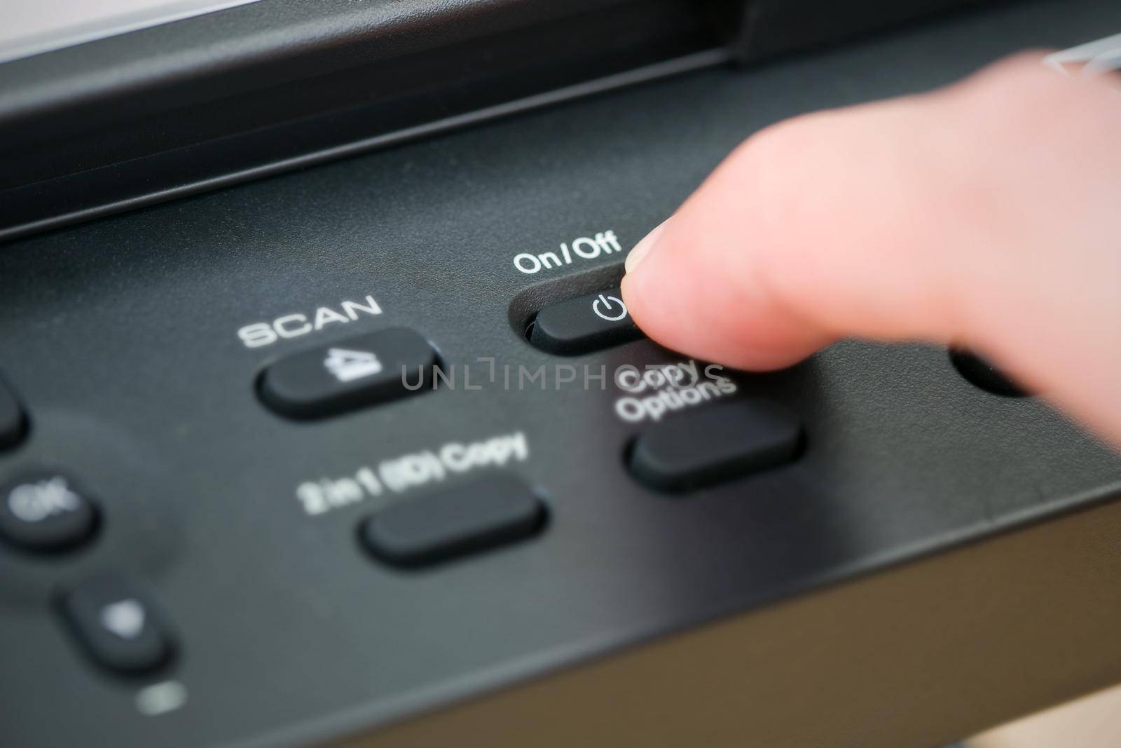 Close-up hand button open the photocopier.