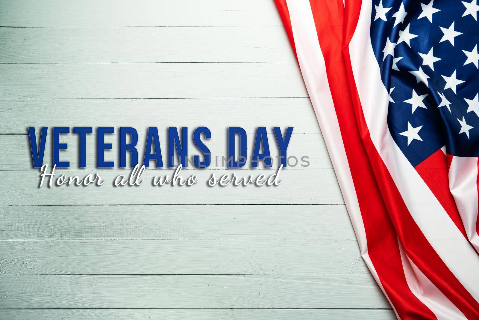 Veterans day. Honoring all who served. American flag on wooden background.