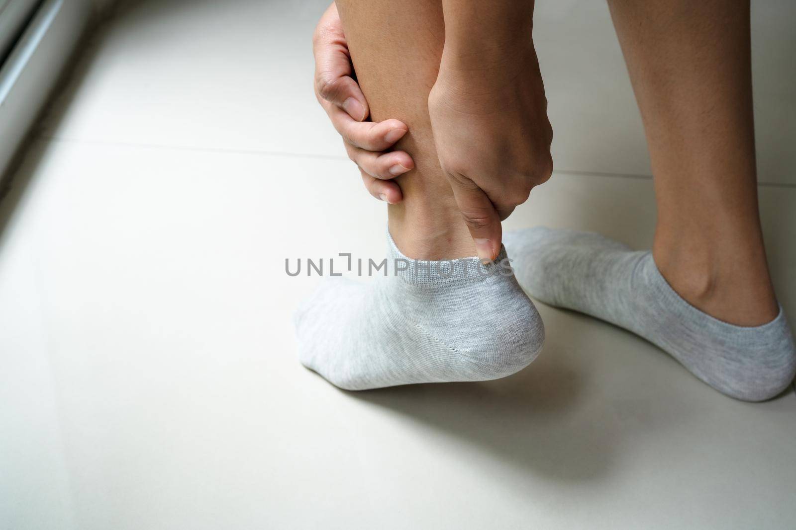 women leg ankle injury/painful, women touch the pain ankle leg