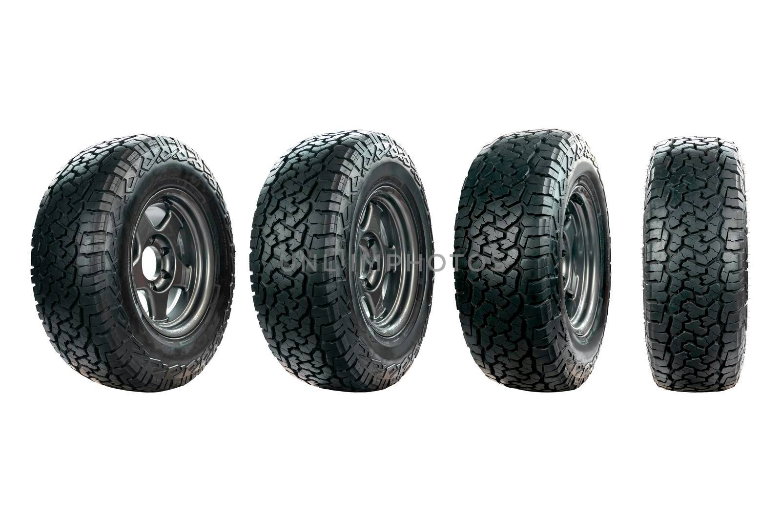 Group of car tire designed for use in all road conditions with alloy wheel isolated on white background.