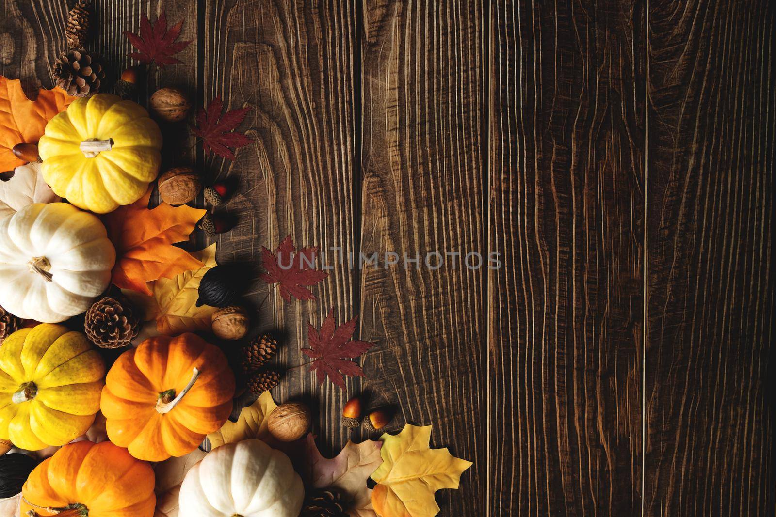 Happy Thanksgiving Day with pumpkin and nut on wooden table