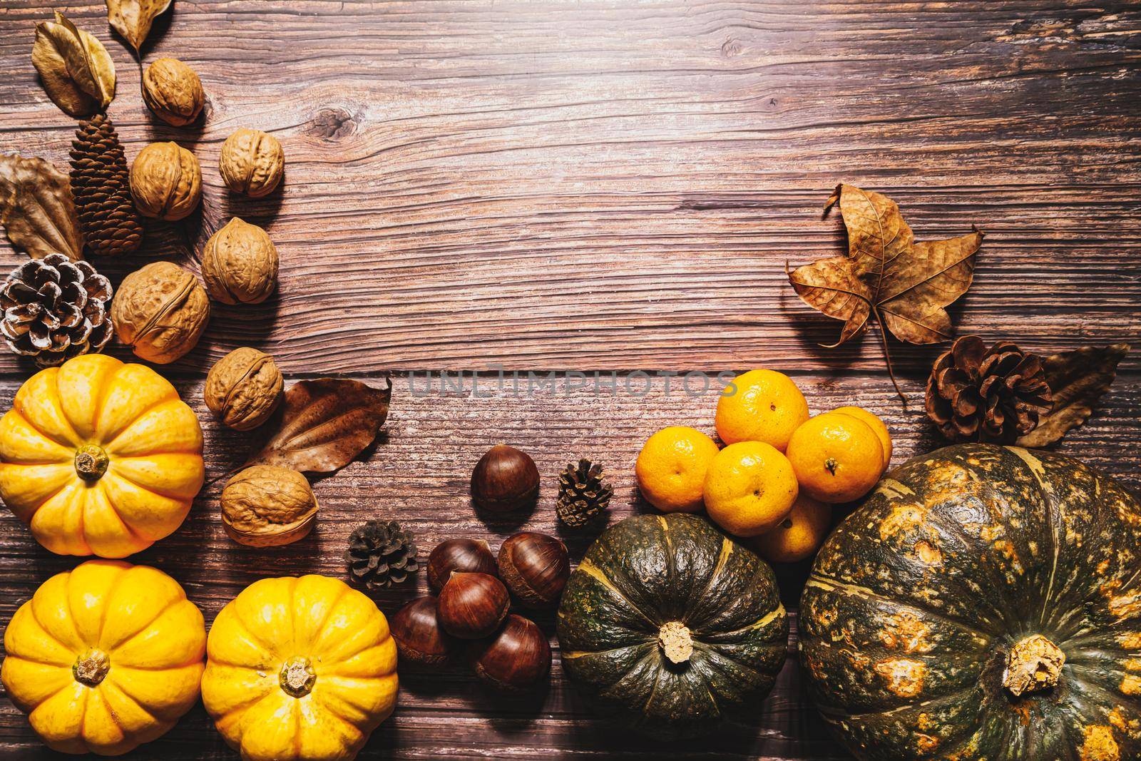 Happy Thanksgiving Day with pumpkin and nut on wooden table by psodaz