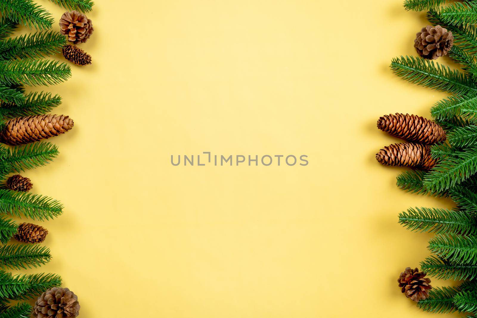 Christmas background, pine tree with xmas decoration on yellow background by psodaz