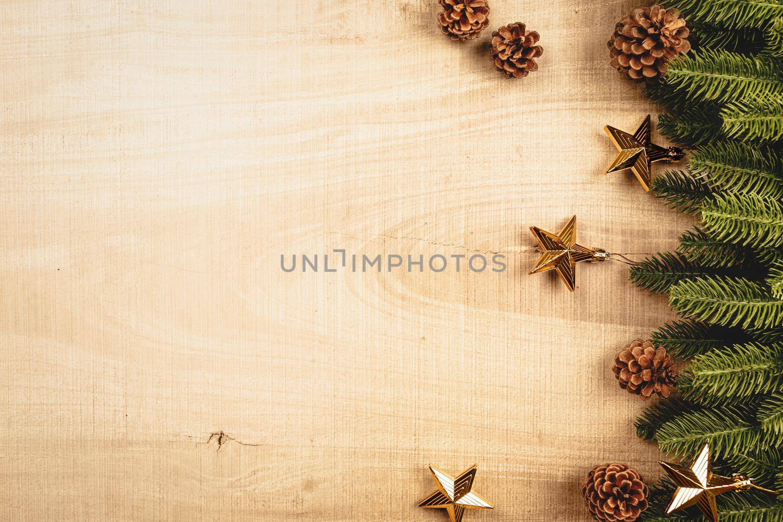 Christmas ball and pine tree with xmas decoration on wooden background