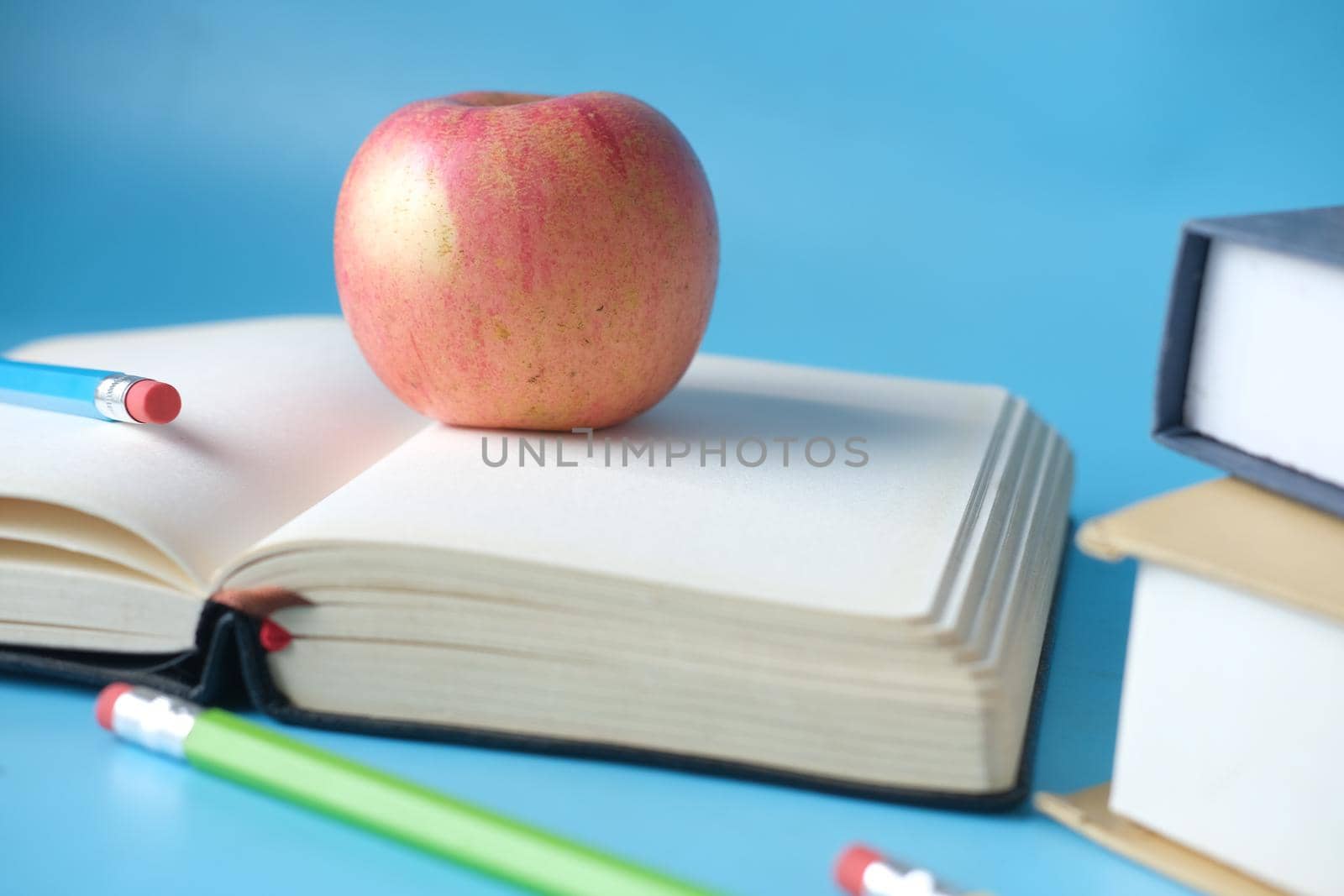black to school concept with apple on notepad on table