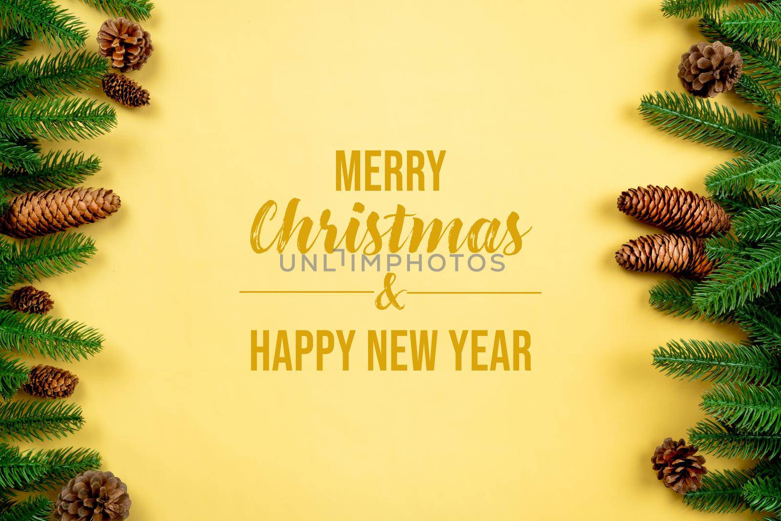Christmas background, pine tree with xmas decoration on yellow background
