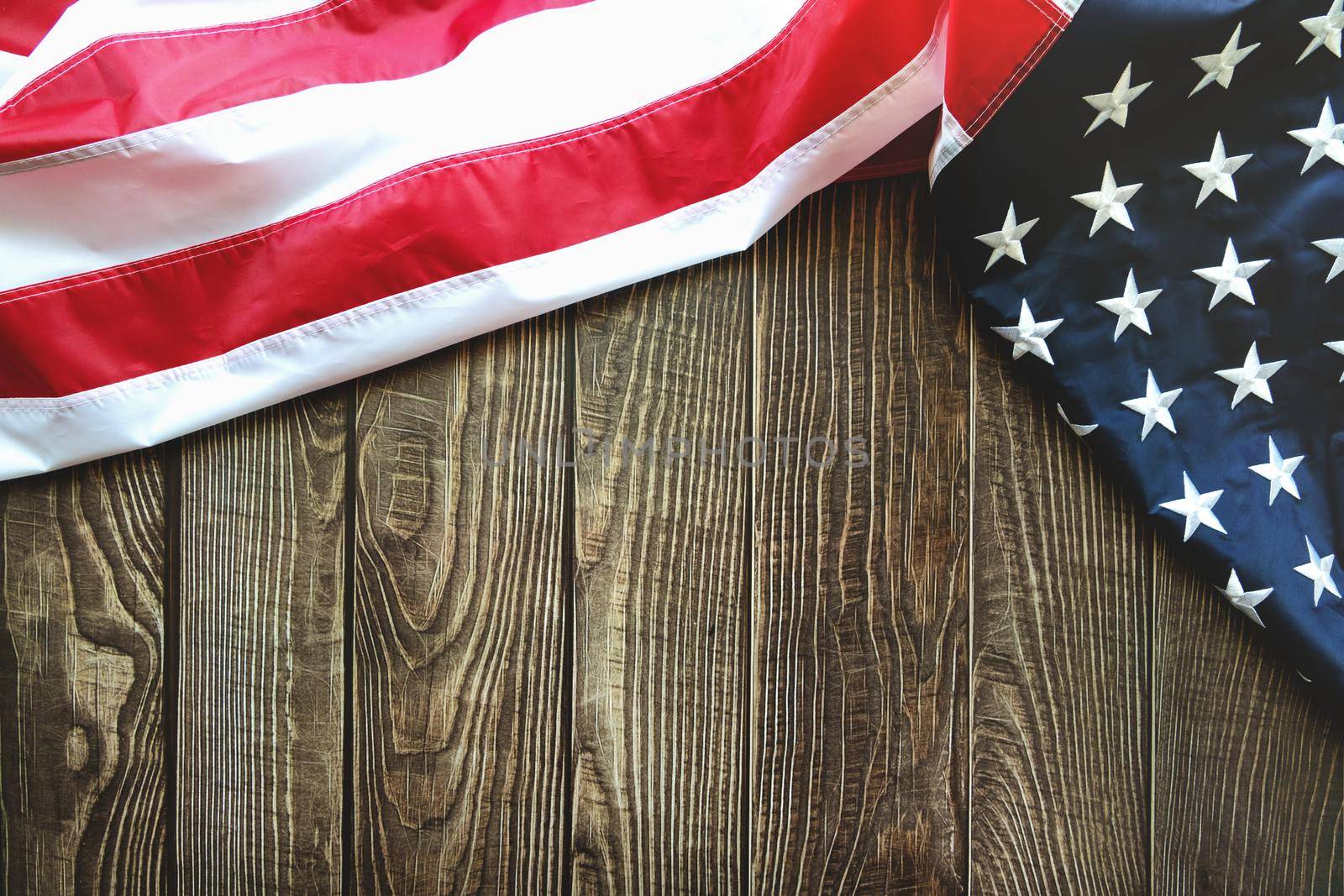 American flag on wooden background with copy space by psodaz
