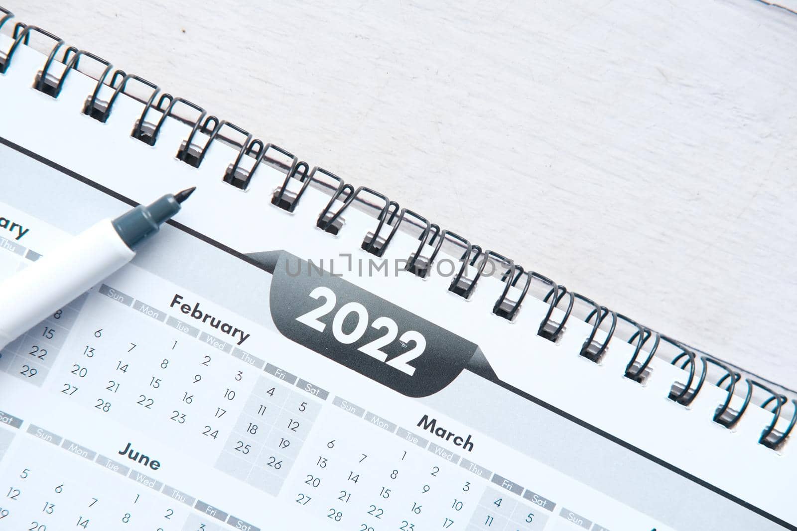 2022 J year calendar on office desk.