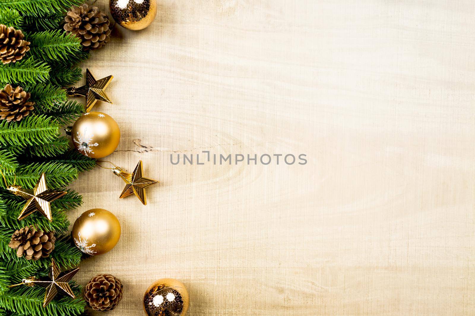 Christmas ball and pine tree with xmas decoration on wooden background by psodaz
