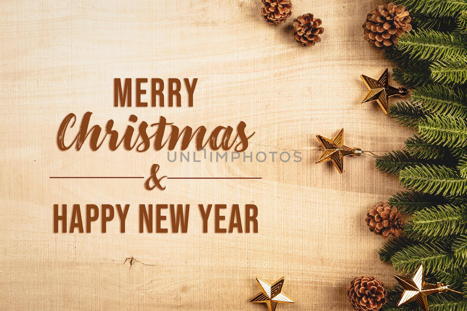 Christmas ball and pine tree with xmas decoration on wooden background