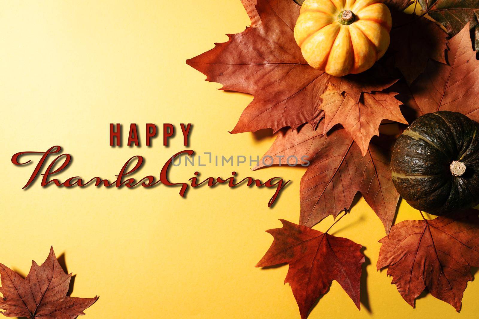 Happy Thanksgiving Day with maple leaves, nut and pumpkin on blue background by psodaz