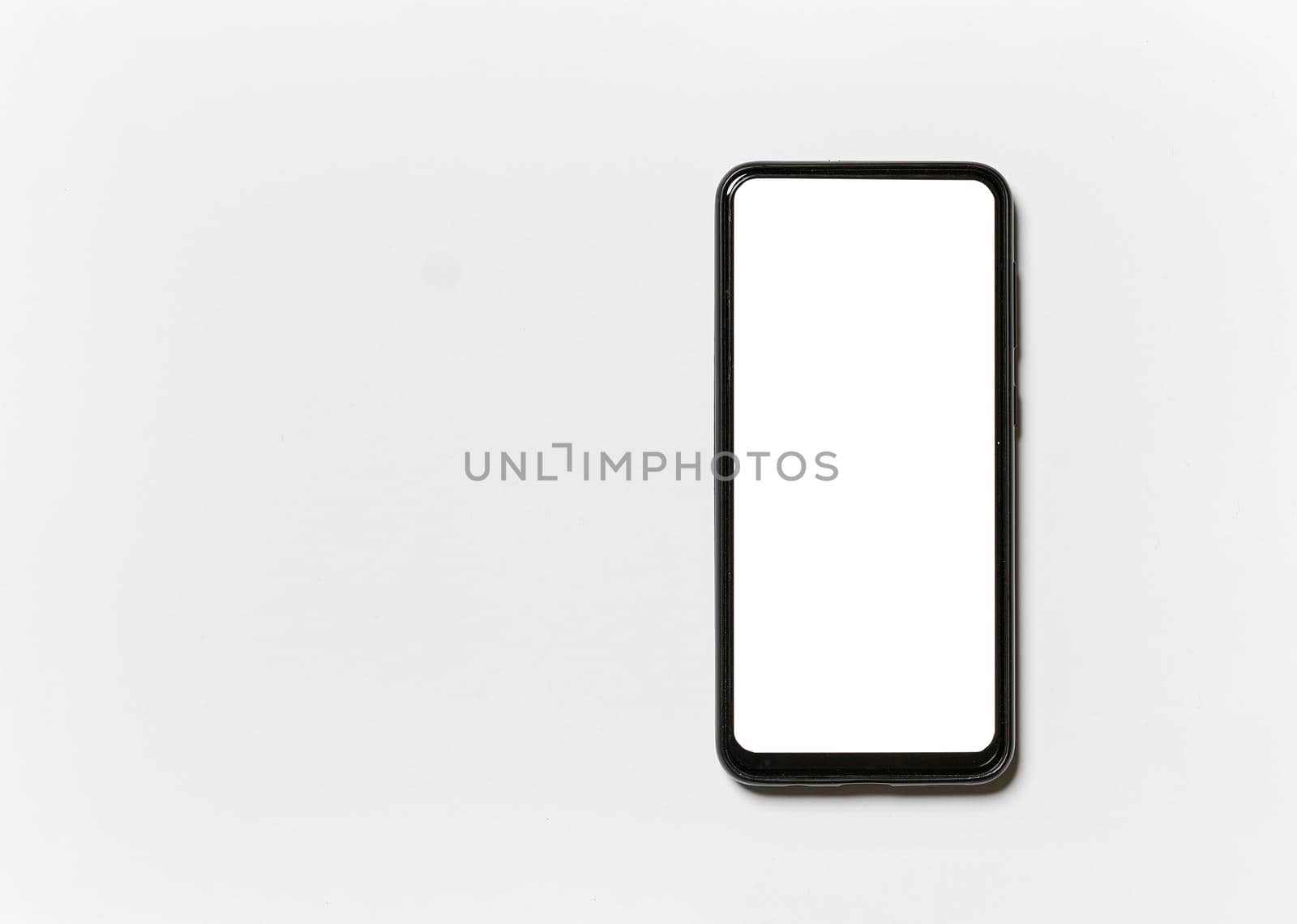 Mobile phone with empty screen on white background