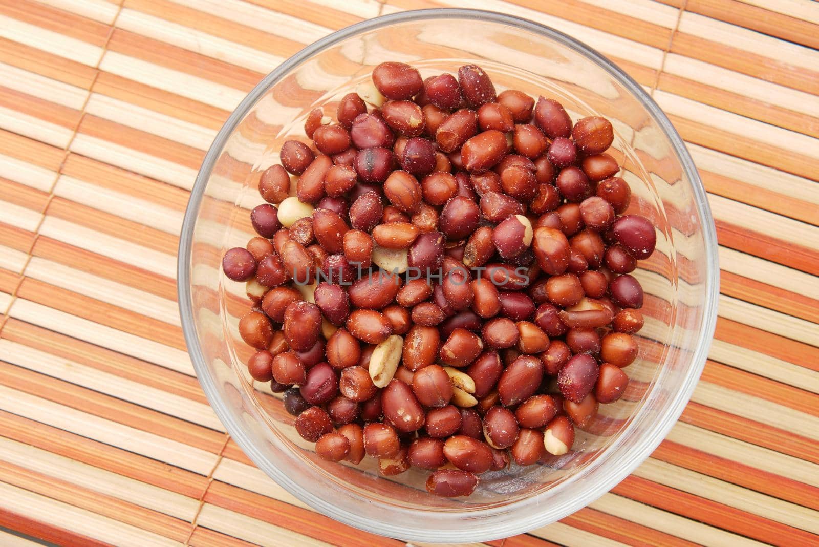 Processed pea nuts in a bowl on table top down