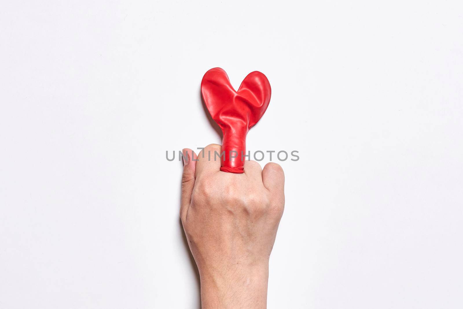 Fuck love. Middle finger and heart shape balloon by golibtolibov