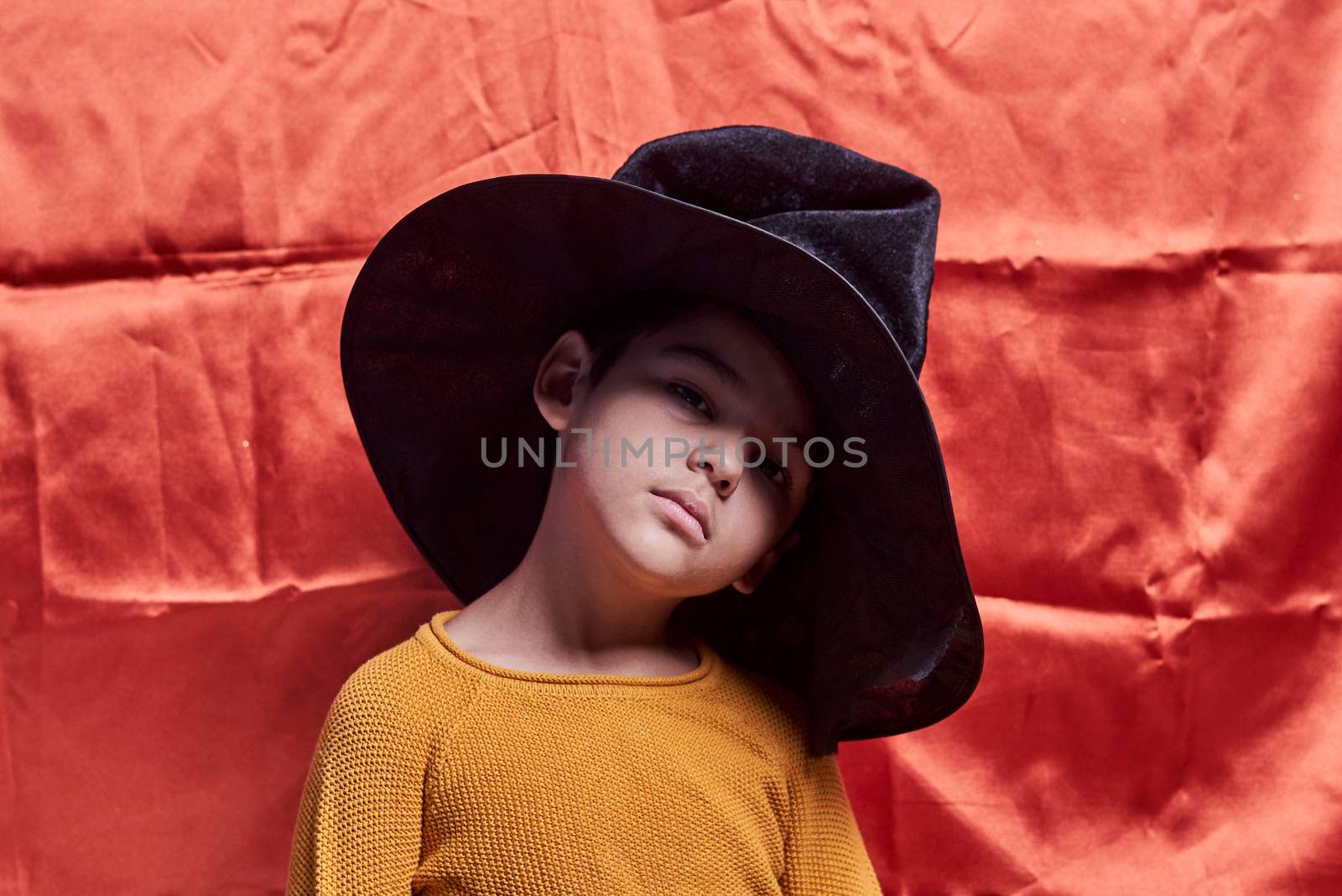 A young kid wearing witch hat by golibtolibov