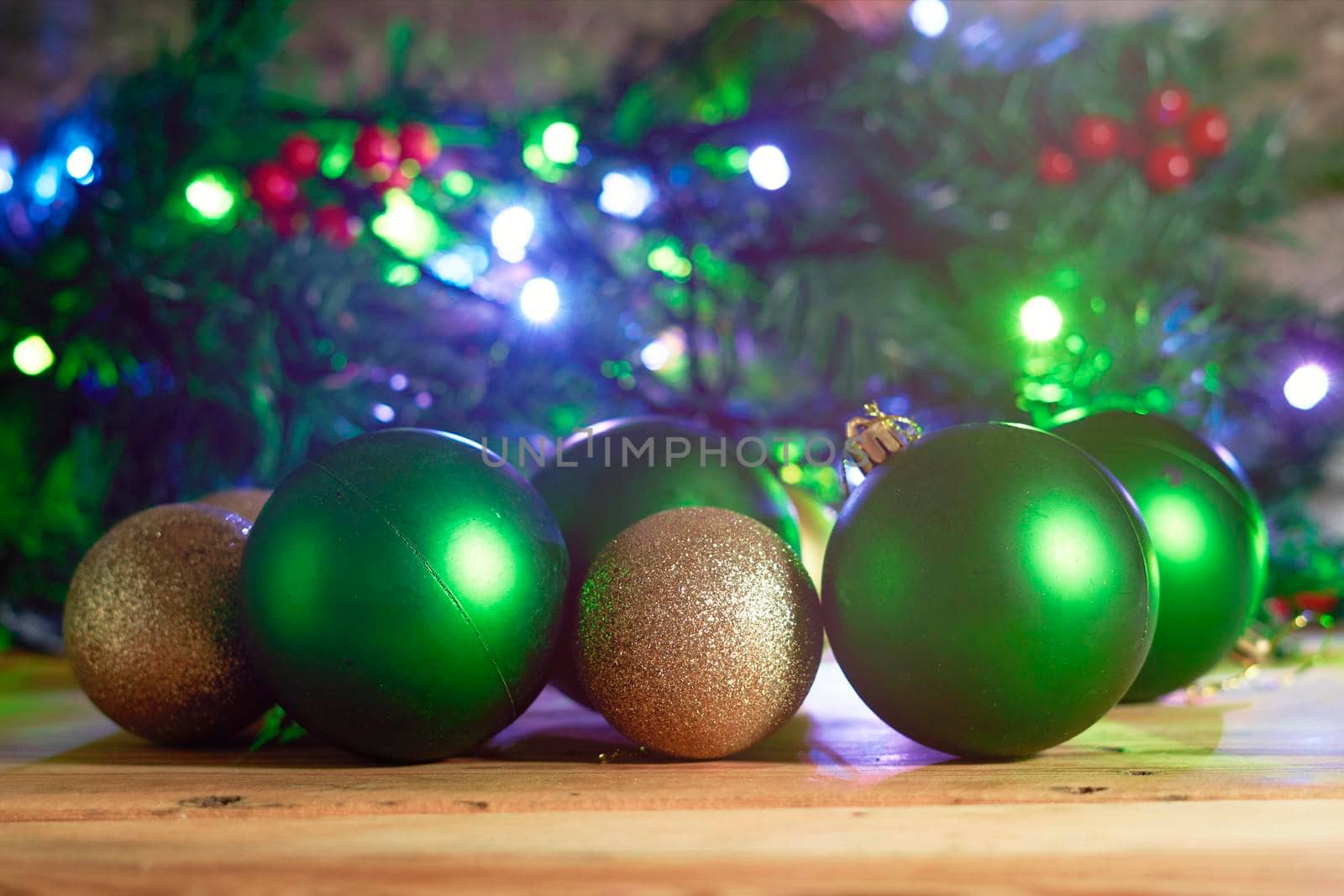 Colorful Christmas tree decorative toy balls. Xmas tree decorations, baubles. Festive Christmas tree decorated with lights