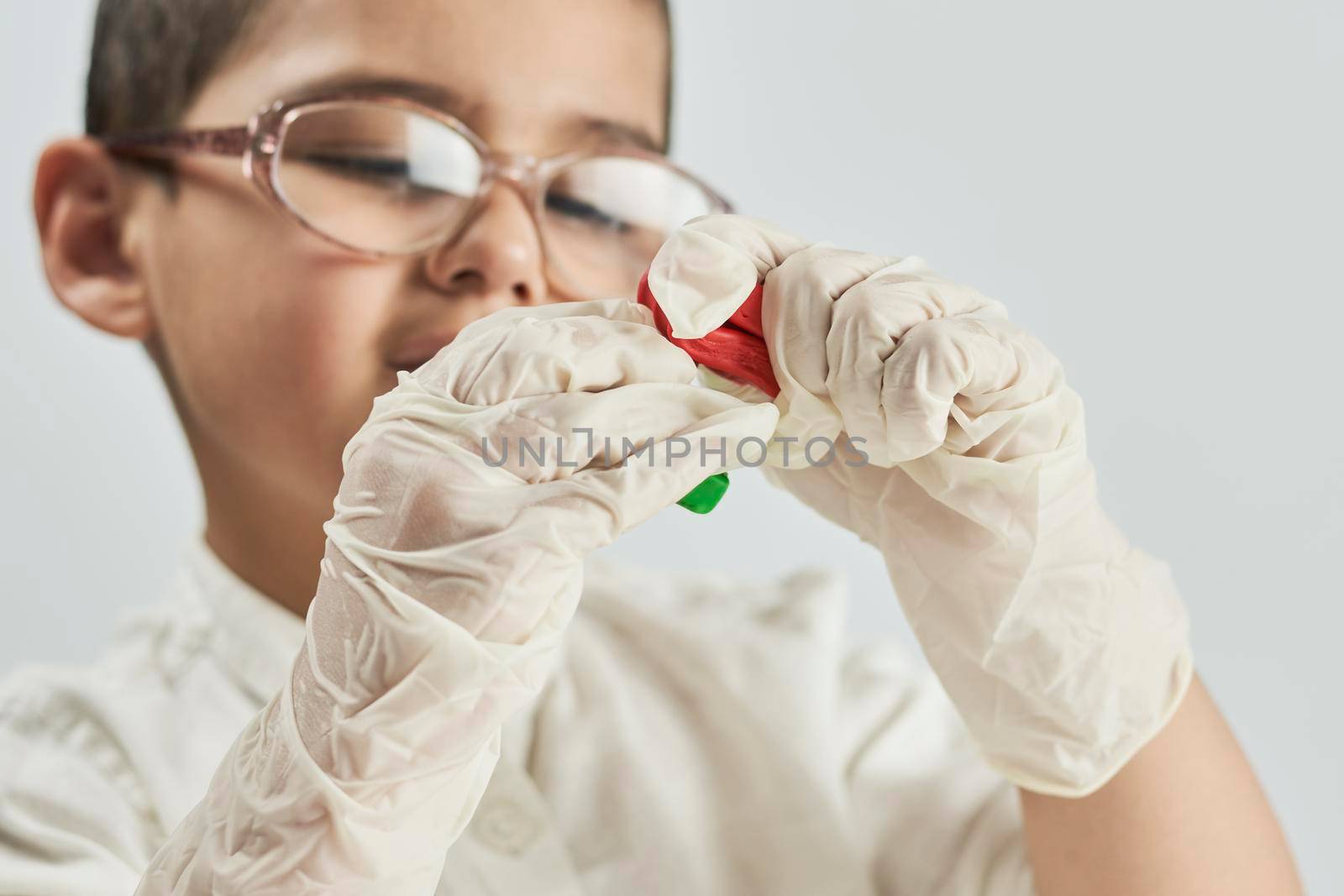 Cute little scientist playing with slime by golibtolibov