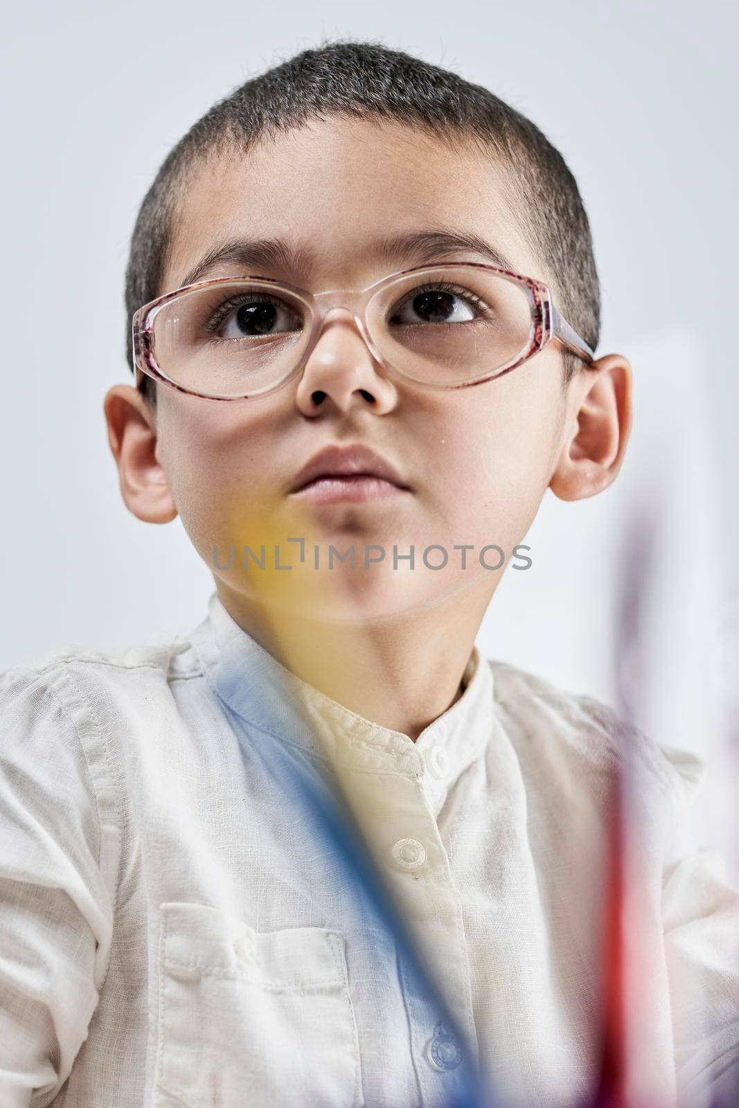 Portrait of smart boy in glasses by golibtolibov