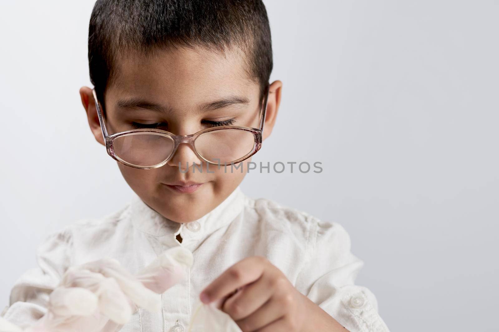 Little boy scientist in lab coat and eyeglasses by golibtolibov