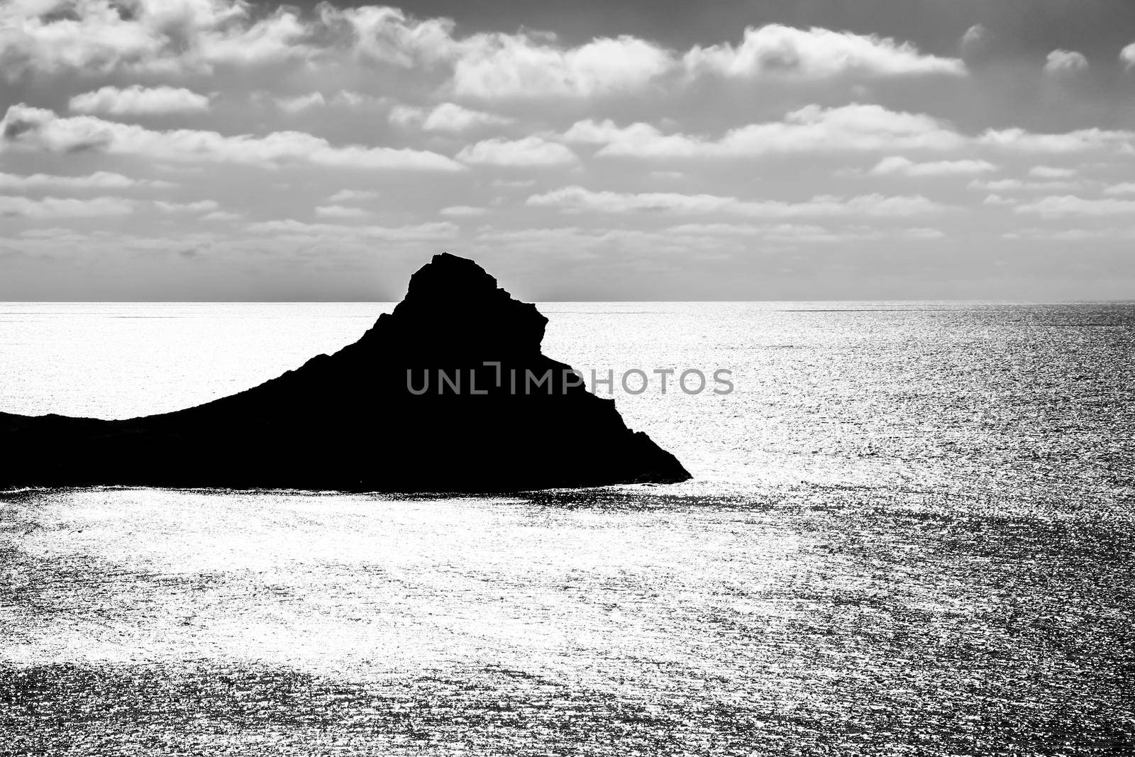 Silhouette of little islet of Siren Reef in Cabo de Gata-Nijar Natural Park, Almeria, Spain.
