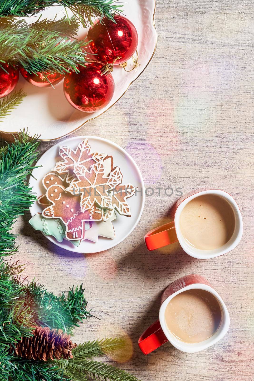 Merry Christmas background with Xmas decors and cookies. Tasty Christmas cookies and X-mas tree baubles. Celebrating Christmas and New year