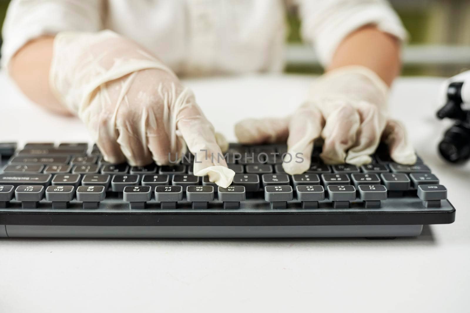 A schoolboy typing on the keyboard by golibtolibov