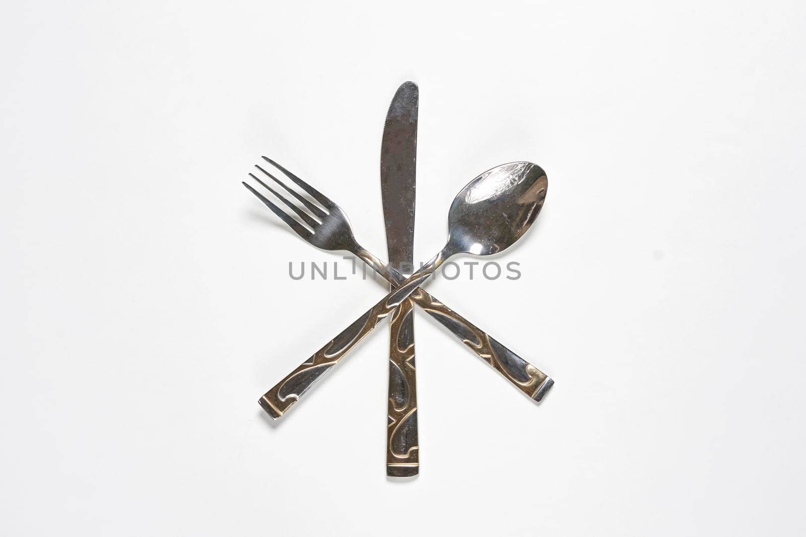 Restaurant eating items - Fork, spoon and knife on white background