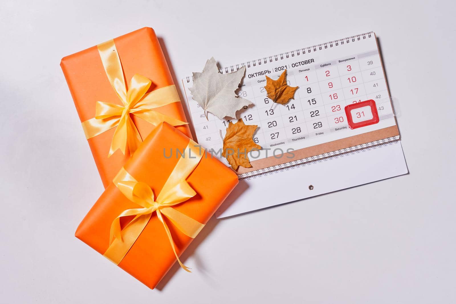 October 2021 monthly calendar and orange giftboxes by golibtolibov