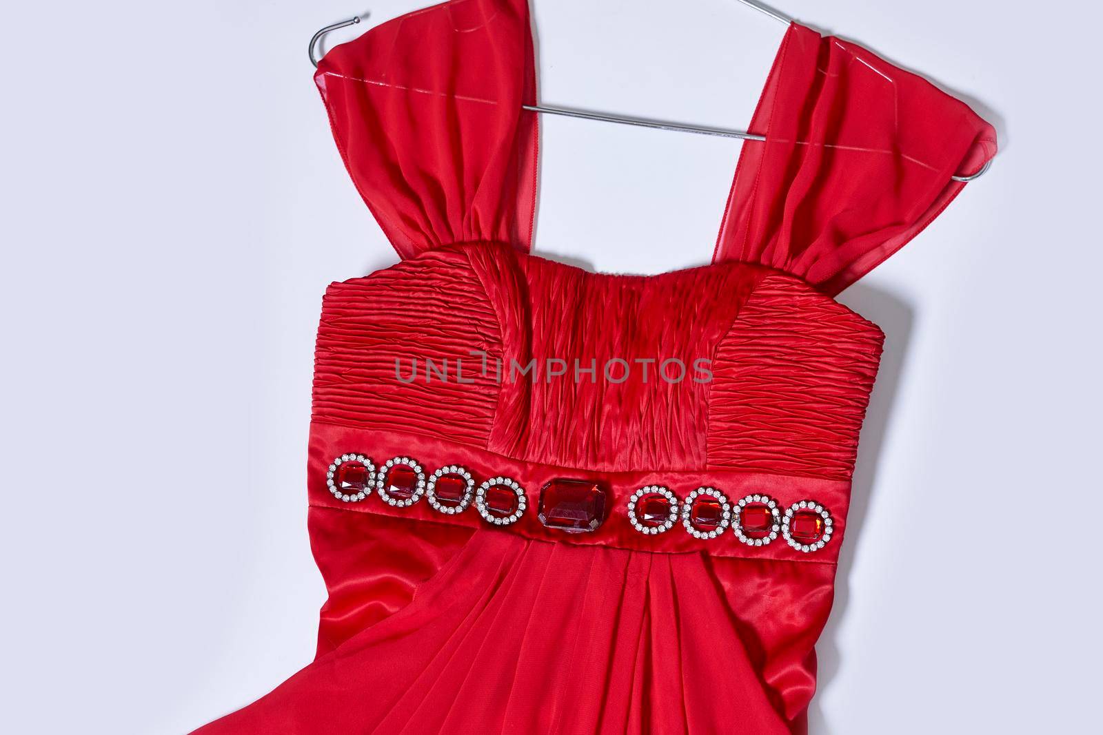 Close-up of red evening gown. Red evening dress. beautiful and trendy women dress