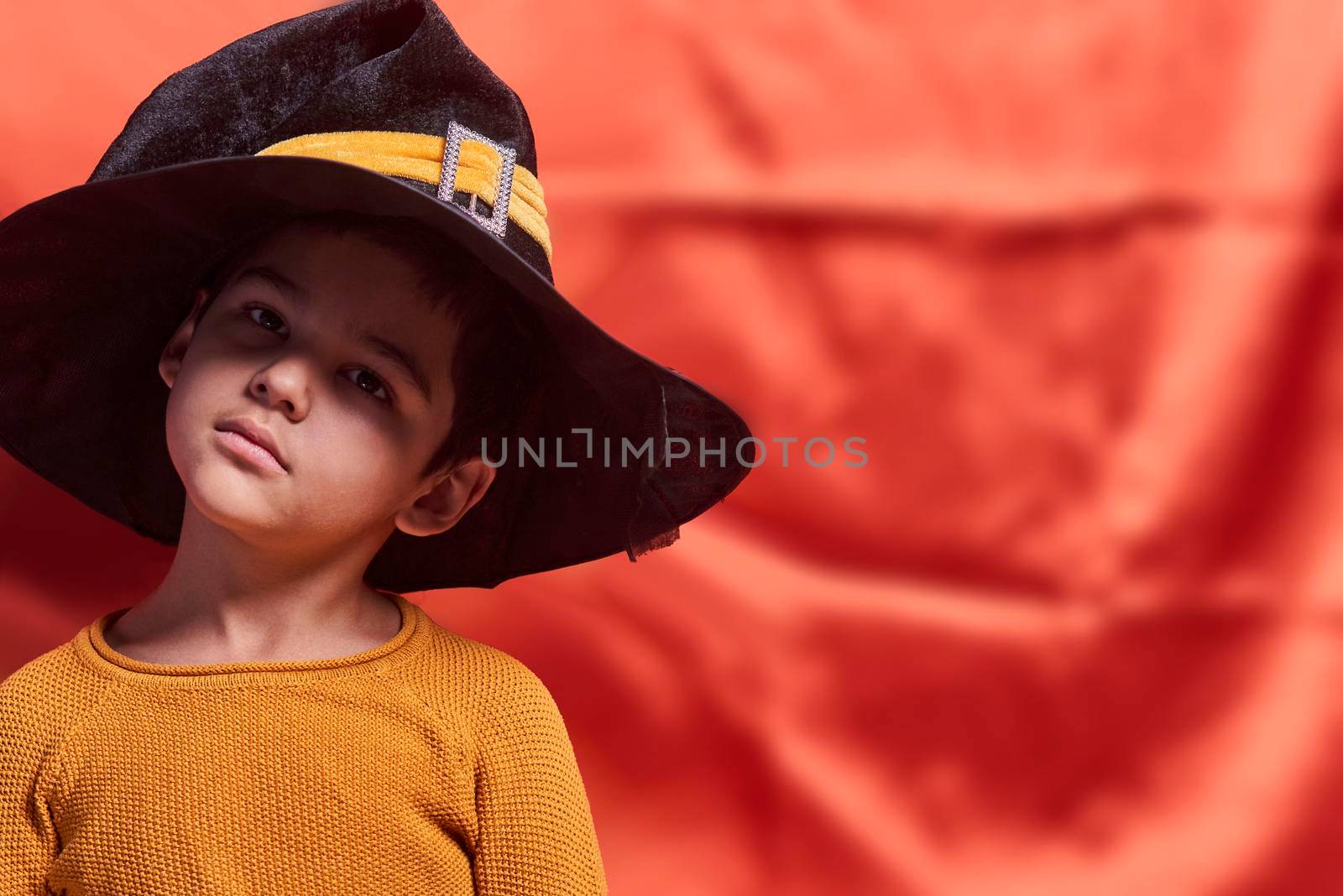 A young kid wearing witch hat by golibtolibov