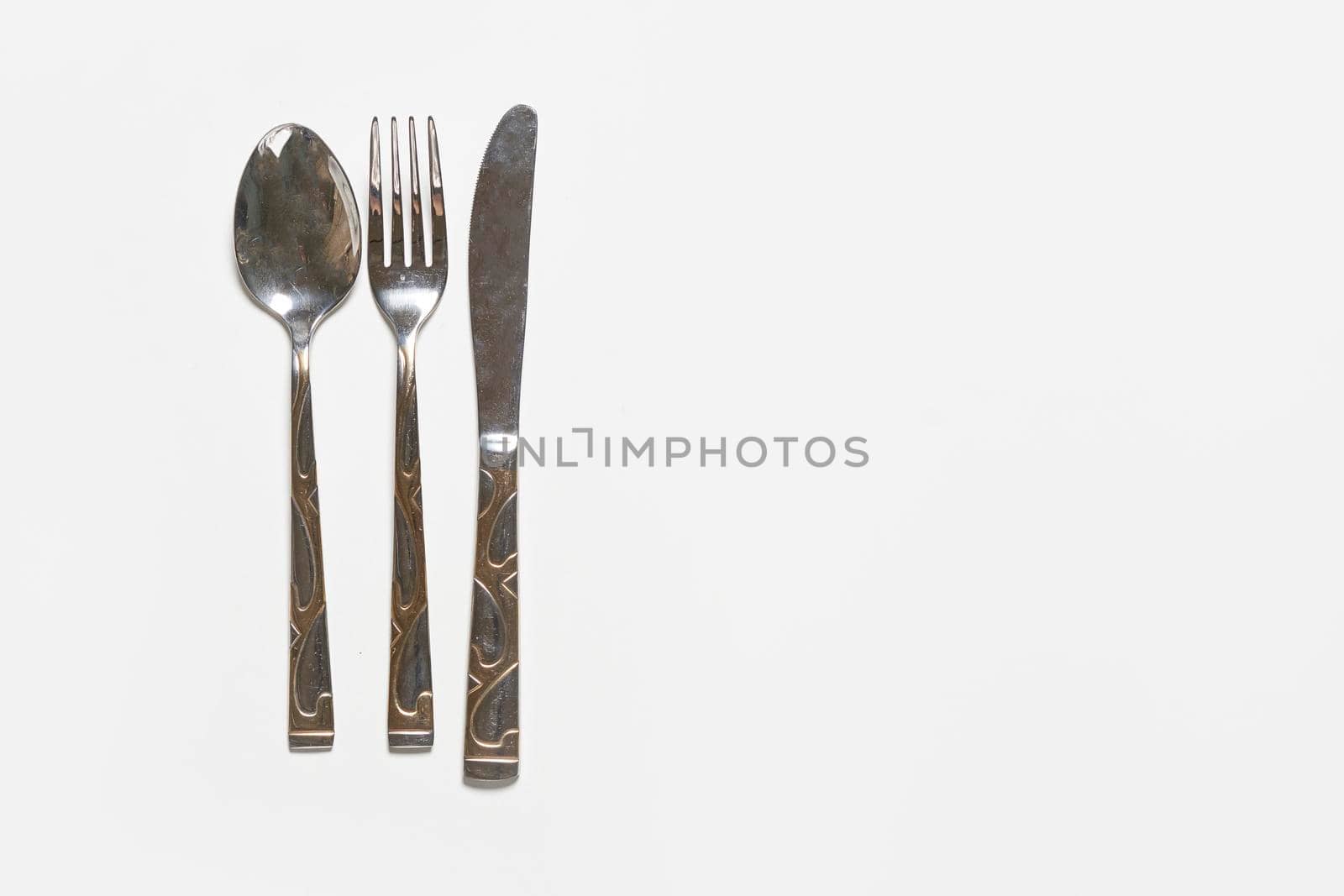 Restaurant eating items - Fork, spoon and knife on white background