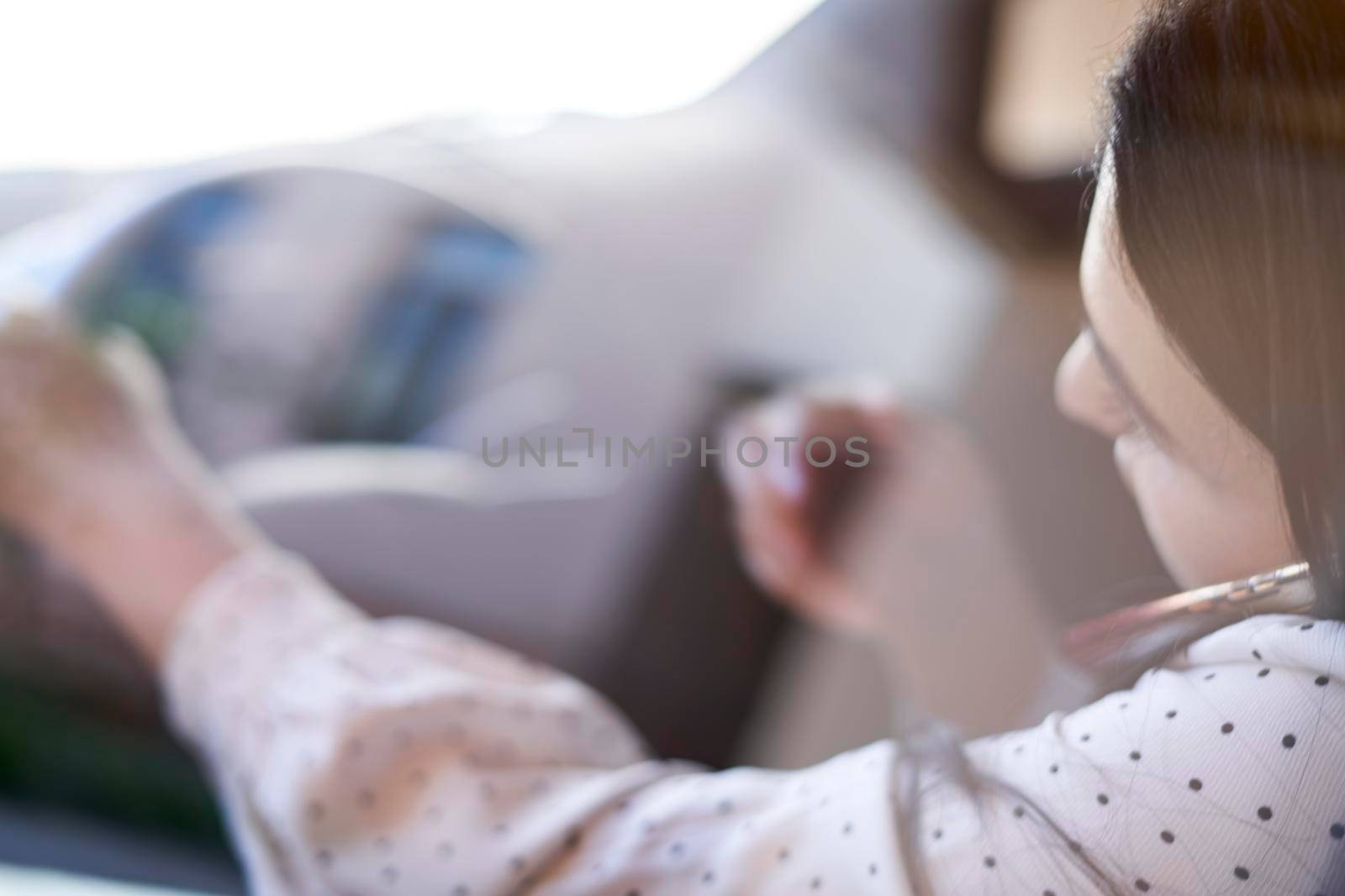 Unsafe driving. Young multiracial woman talking on the phone while driving. Distracted Driving. Female driving and talking on cellphone