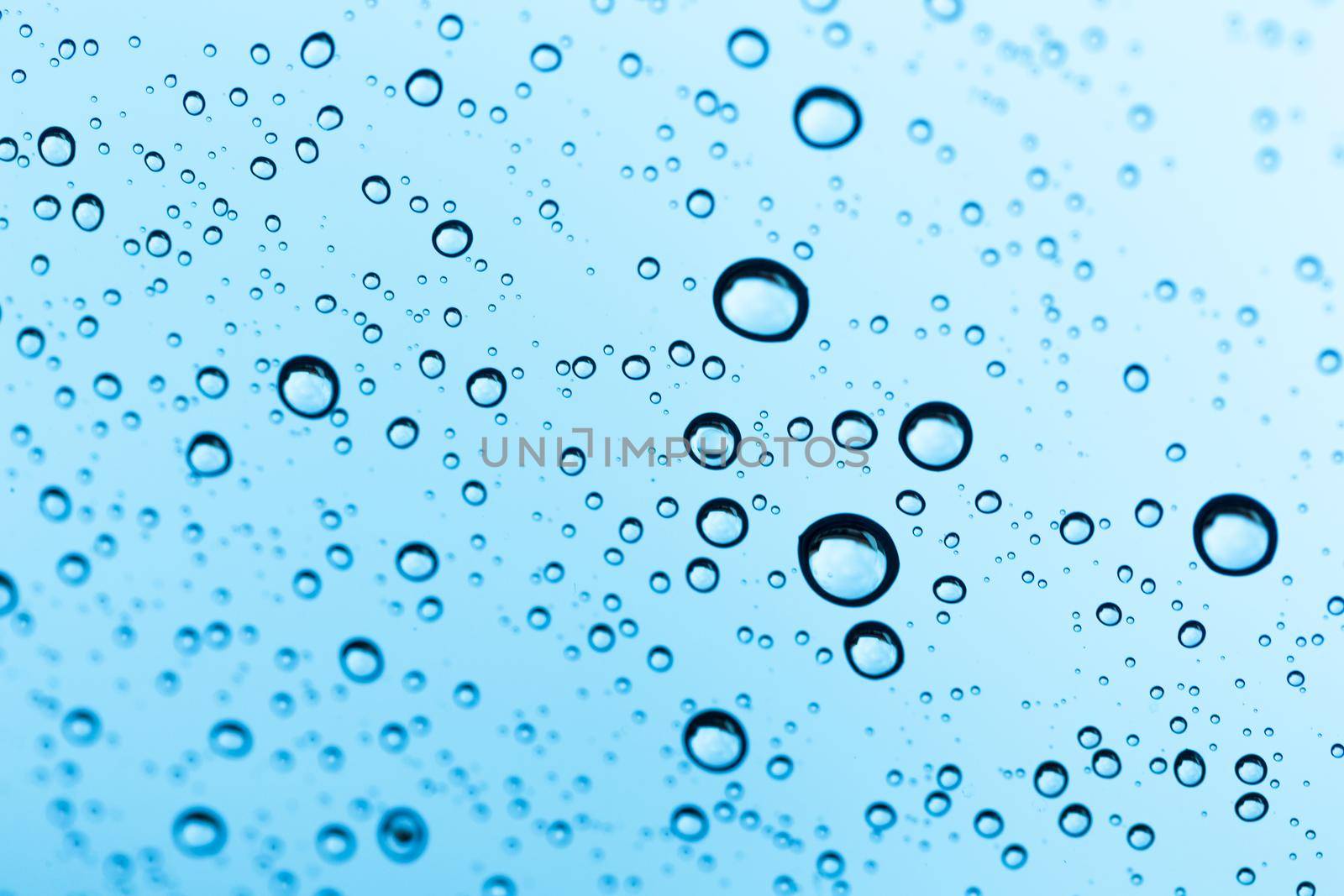 Water drop under water on background.