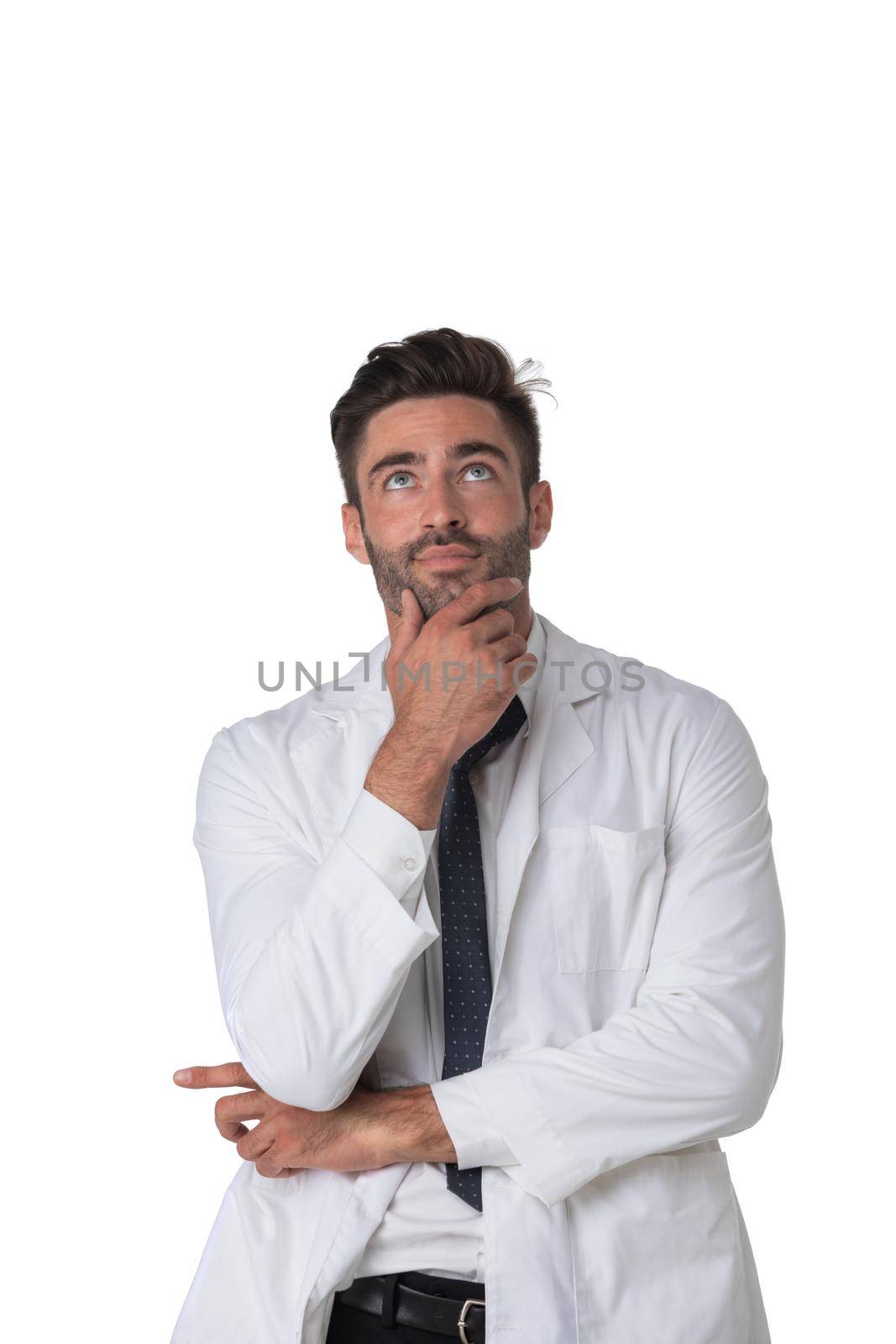 Young doctor surgeon man over isolated white background with hand on chin thinking about question, pensive expression. Doubt concept.