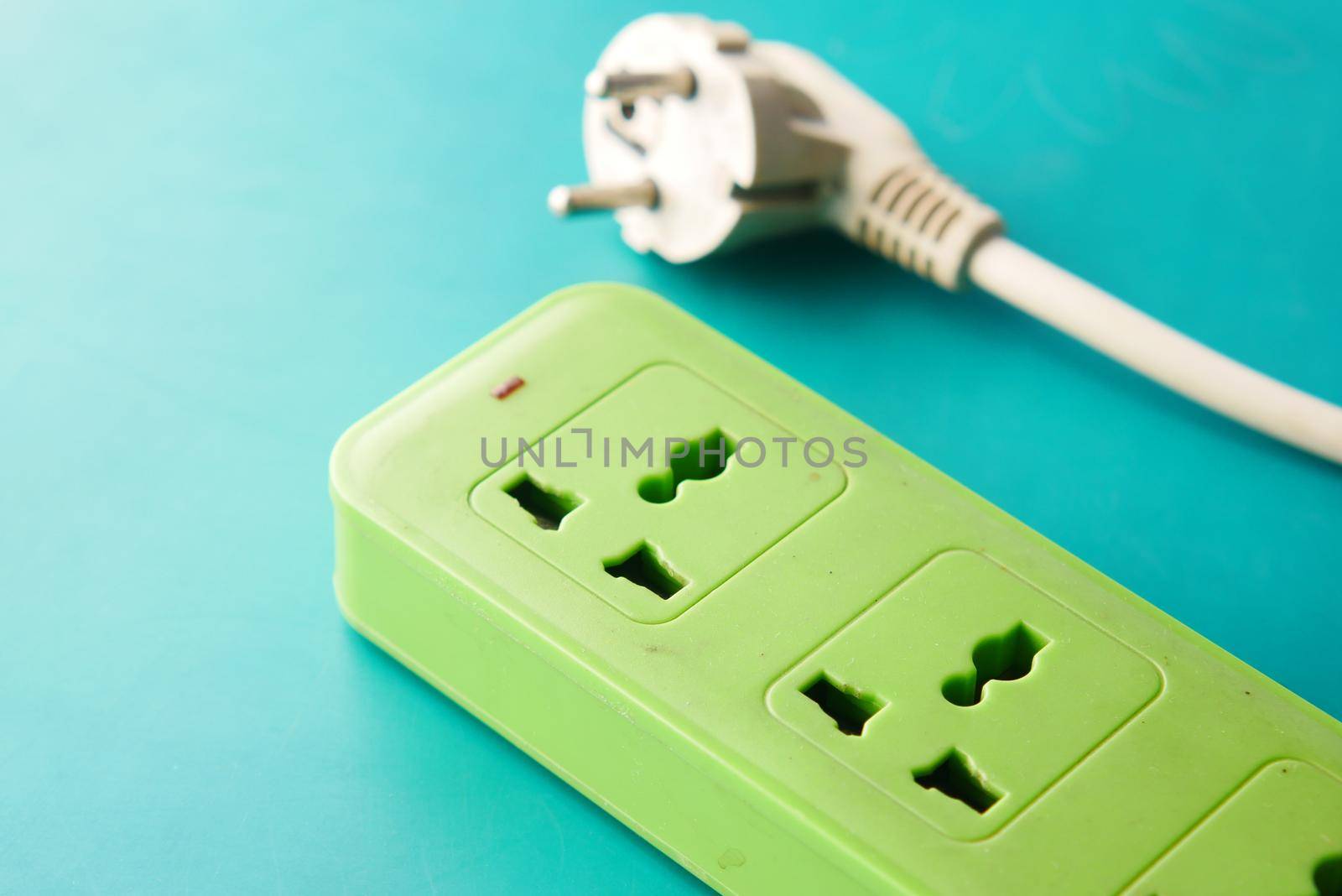 Electrical switch and plug on color background