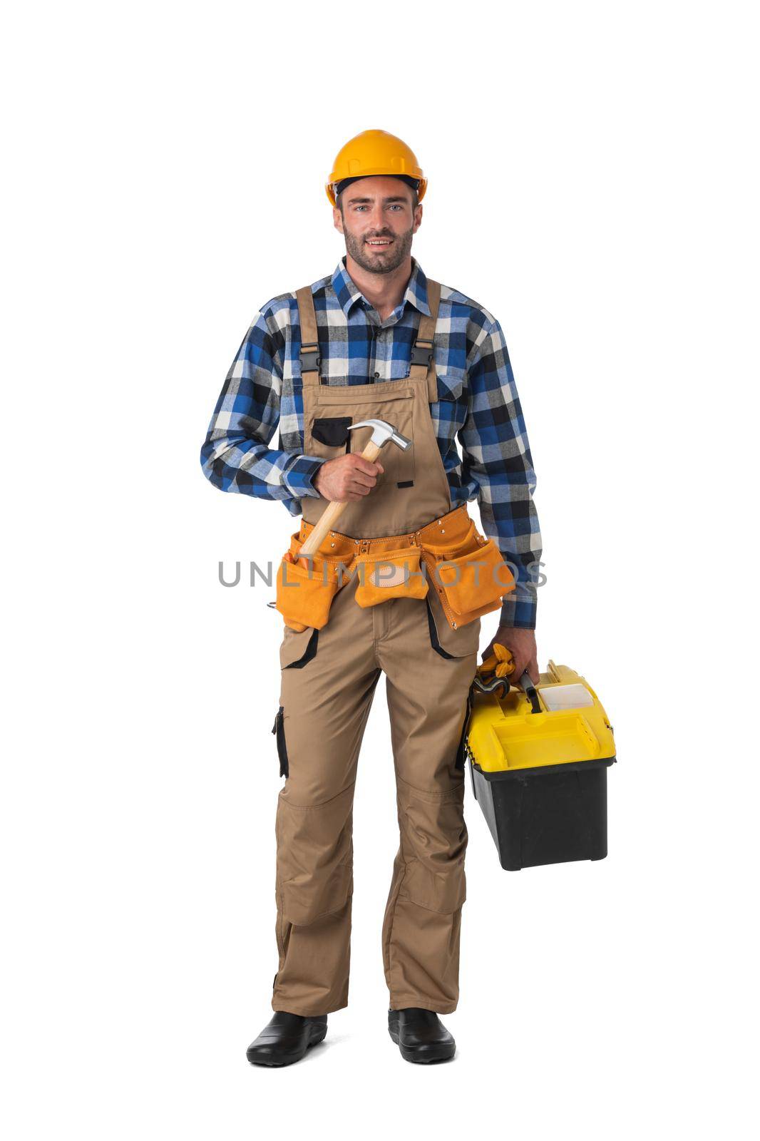 Handsome construction worker with tool-belt, full length portrait isolated on white background