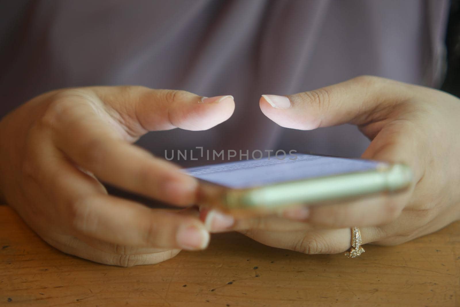 close up of women hand holding smart phone.