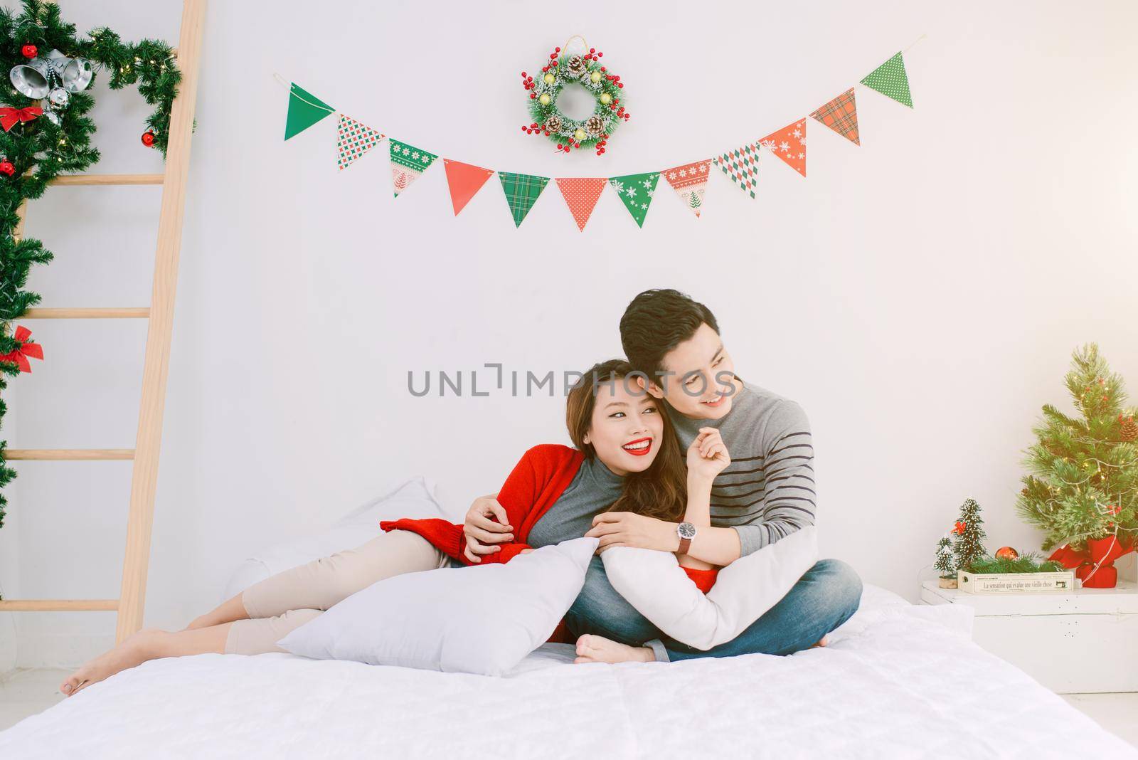 Christmas. Asian Couple at home celebrating New Year.