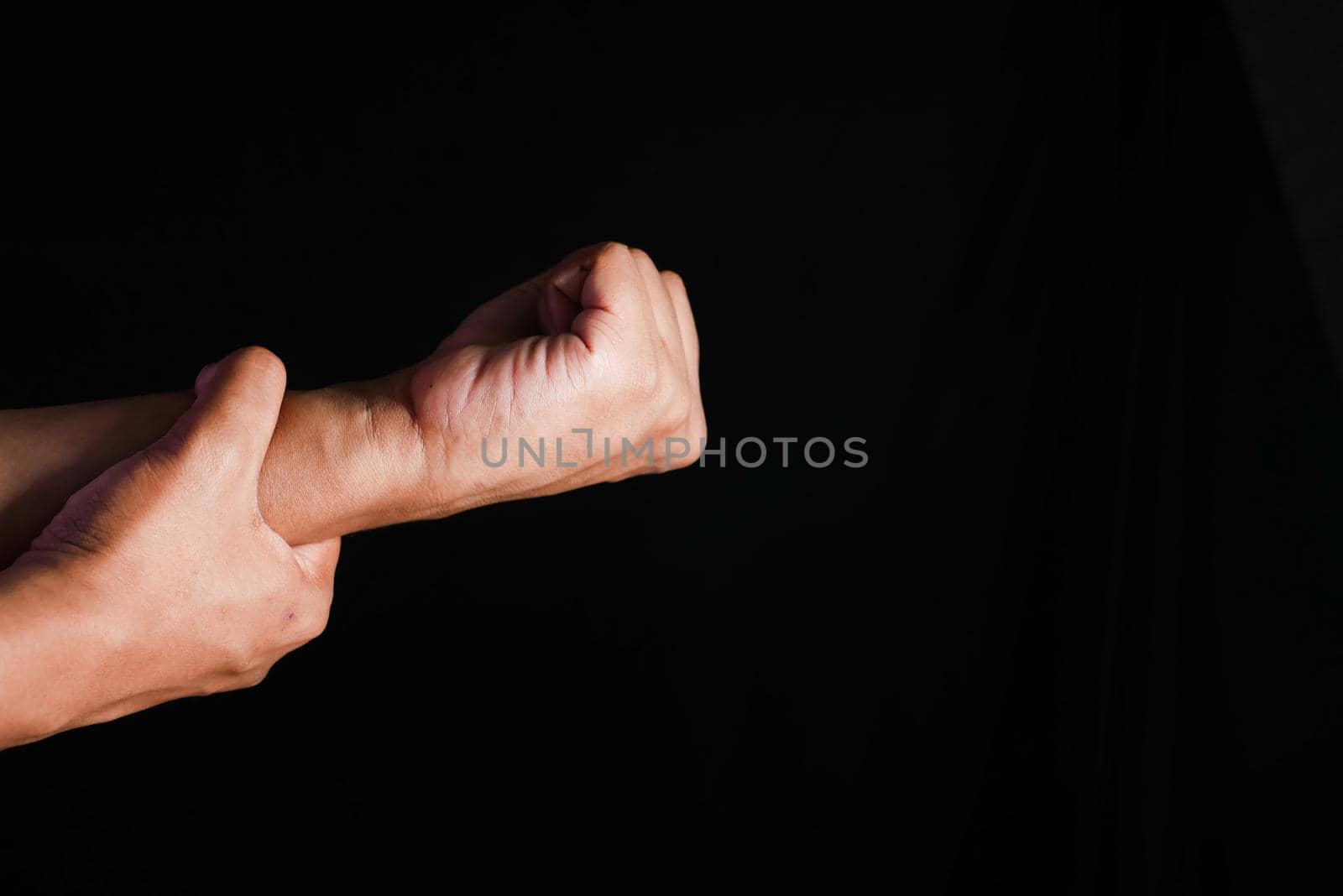 man suffering pain in hand close up .