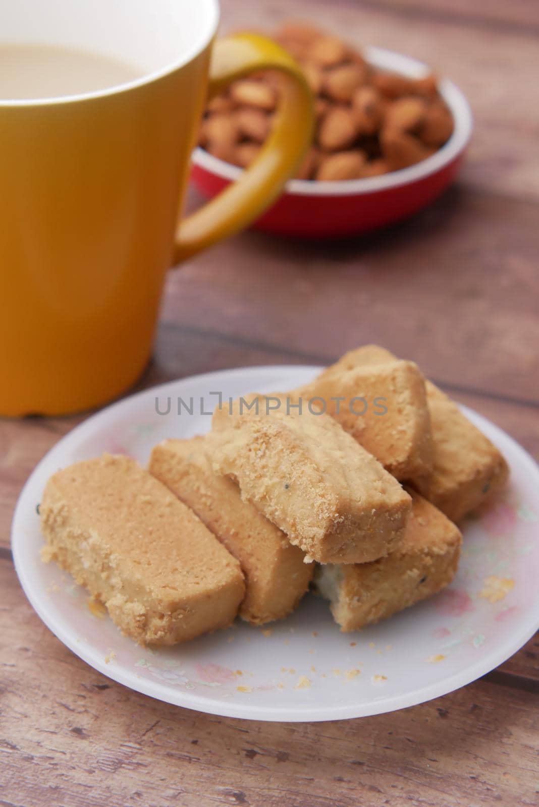 Close up of cookies and tea on table .