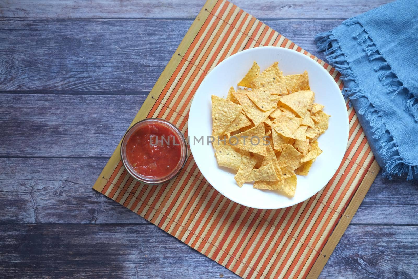 a bowl of chips and salsa on table