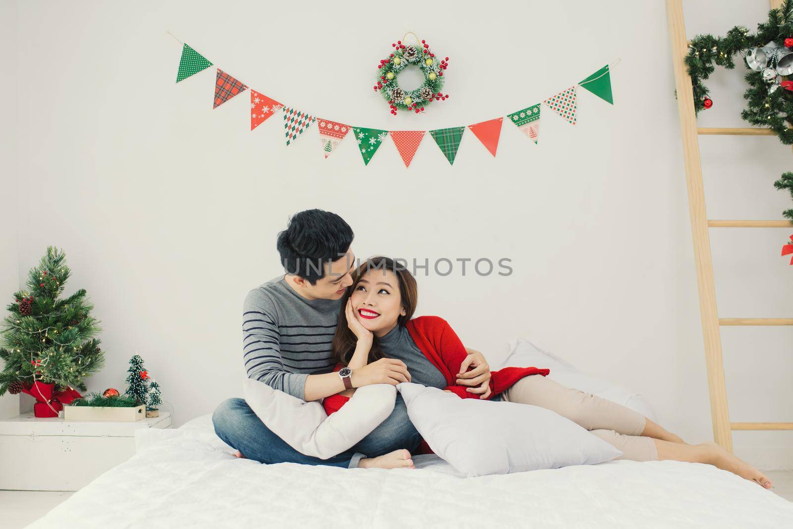 Christmas. Asian Couple at home celebrating New Year.