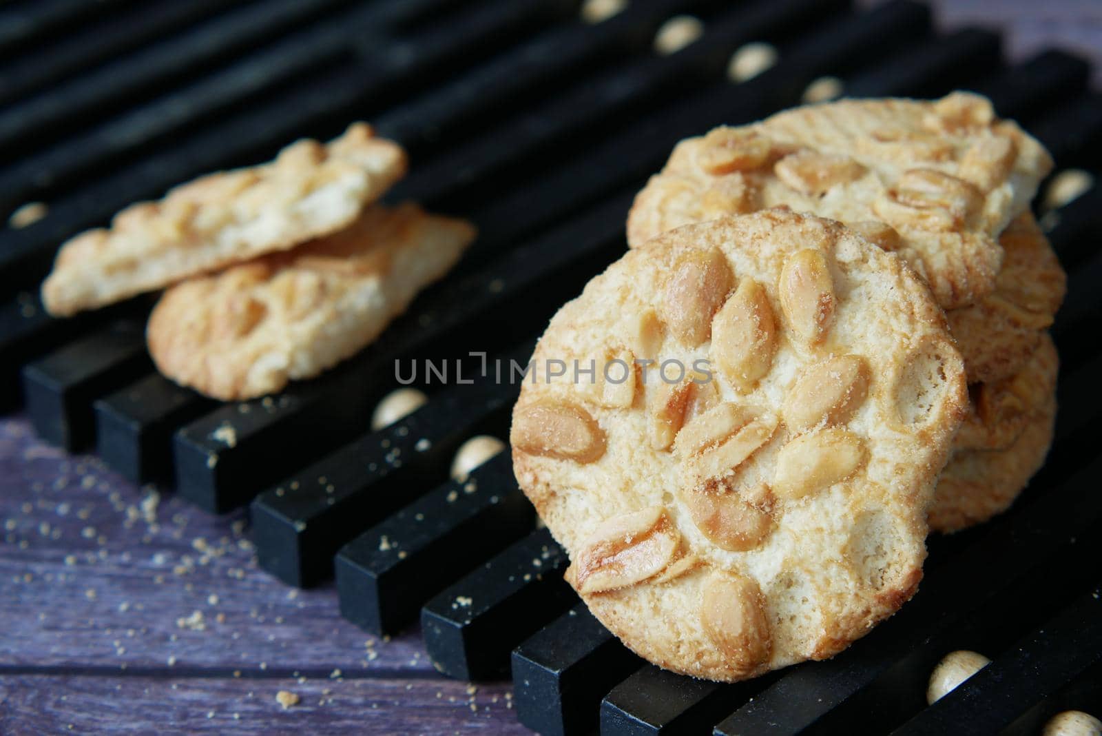 close up of peanut cookies on wooden table .