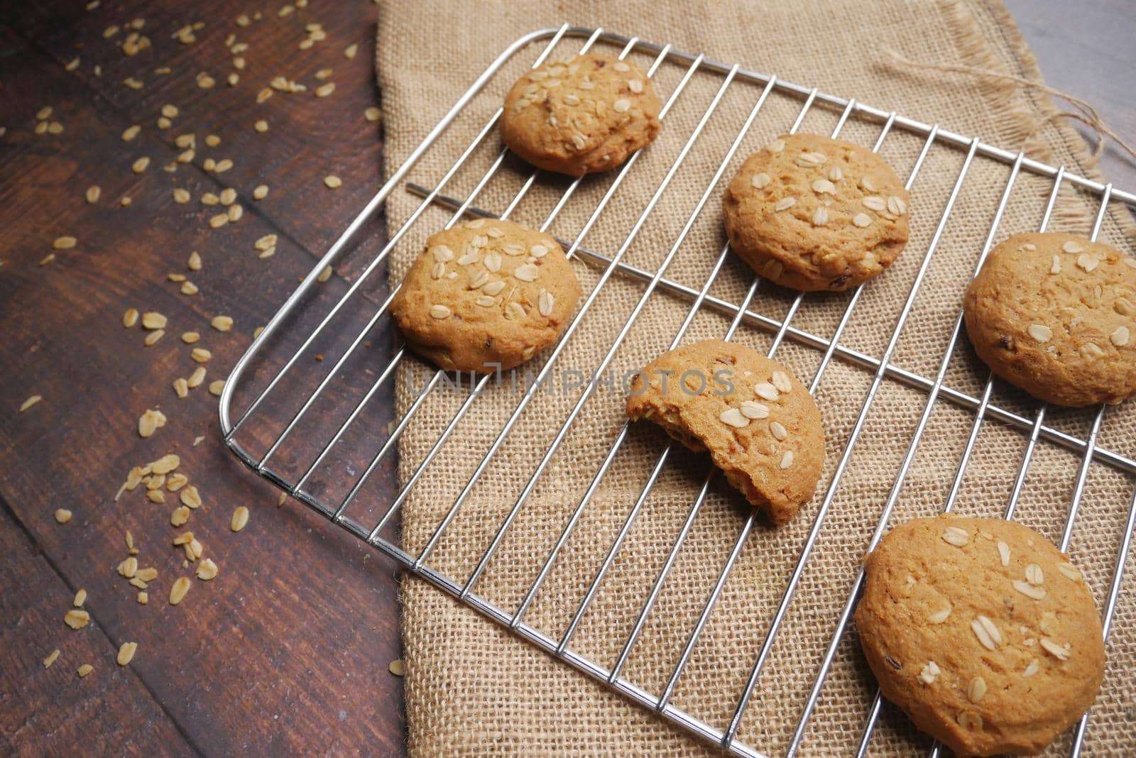 stack of chocolate cookies on wooden background.