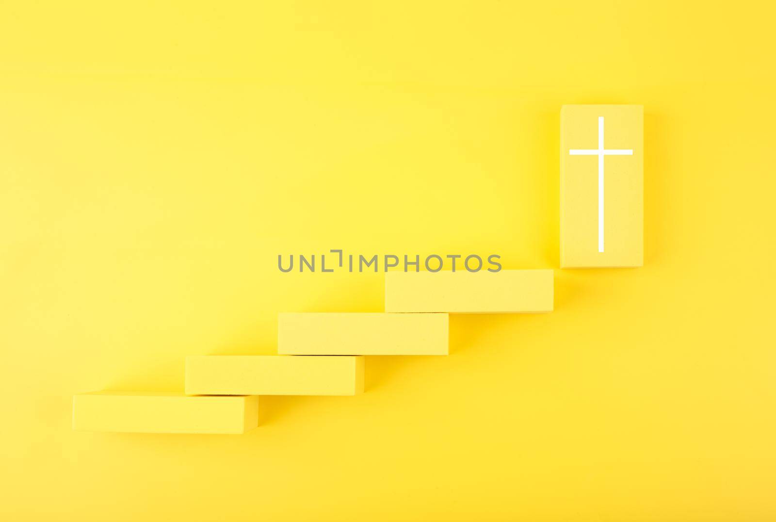 Modern biblical creative religious concept of steps or ladder to faith and God. Yellow steps to cross at the last step.