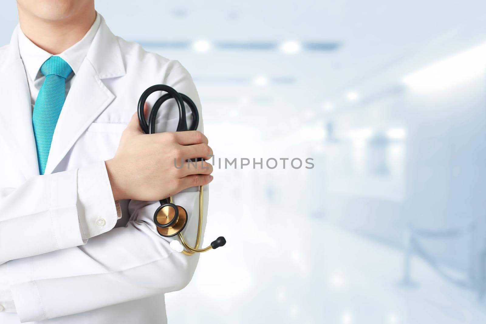 Doctor leading a medical at the blurry hospital background.