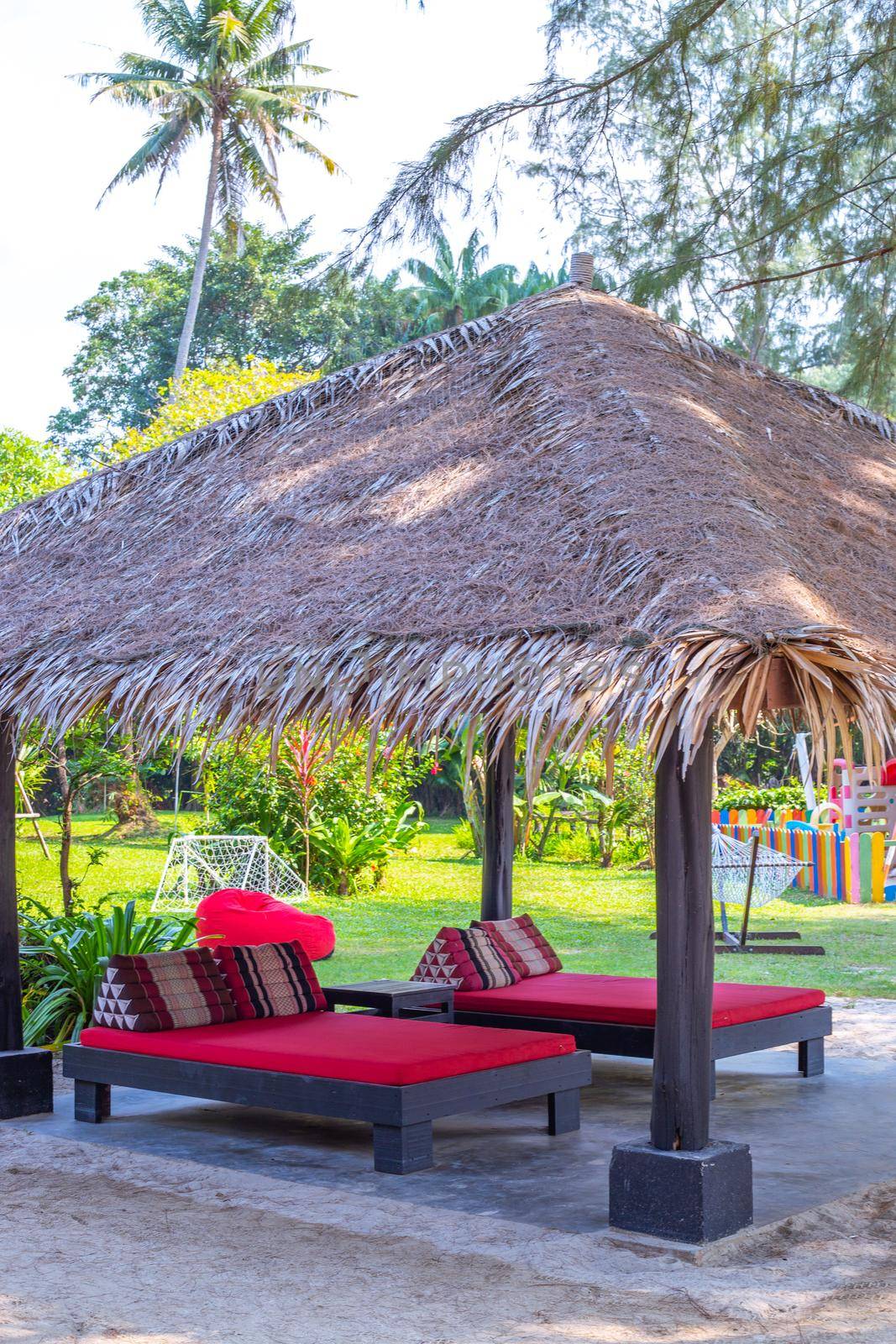 outdoor massage couches, under canopy, spa and relaxation services in asia