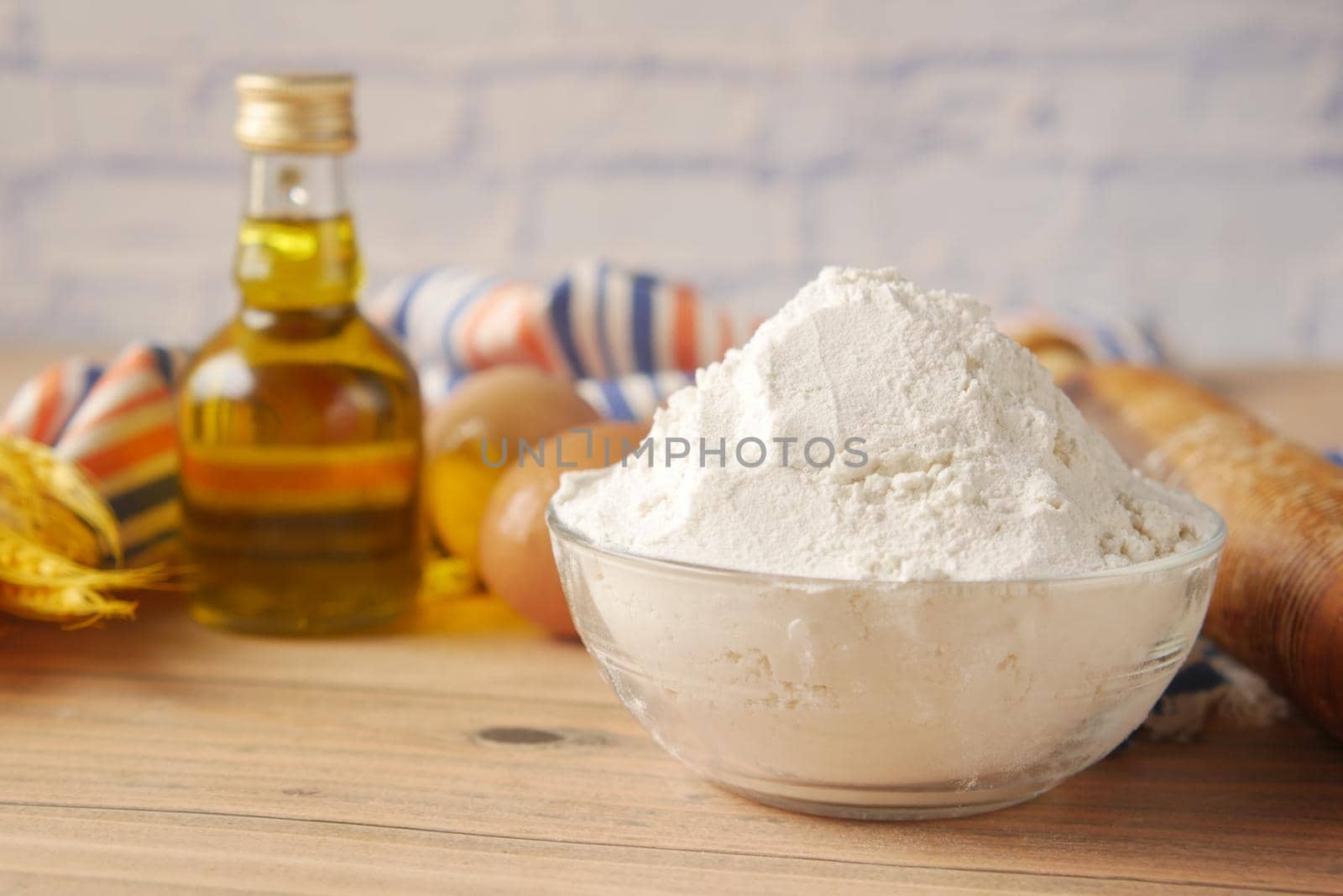 wheat flour in a bowl on table ,